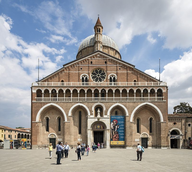 The Basilica of St Anthony in Padua: a brick façade crowned with domes and slender towers.