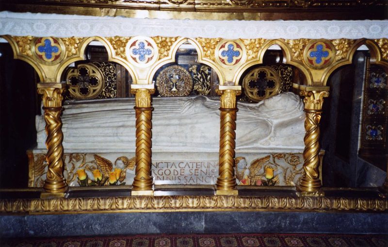 The tomb of St Catherine of Siena beneath the high altar of Santa Maria sopra Minerva, Rome, behind a gilded grille.