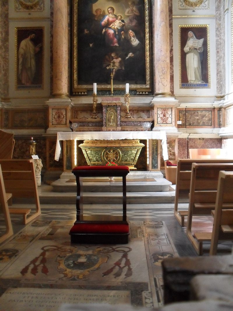 The chapel of St Monica in the church of Sant’Agostino, Rome: a marble altar beneath a painting, with her tomb below.