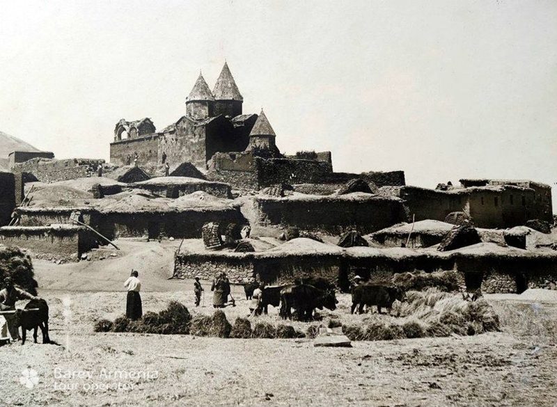 A photograph of the monastery of Narek in 1911: old stone buildings and a domed church on a hillside.