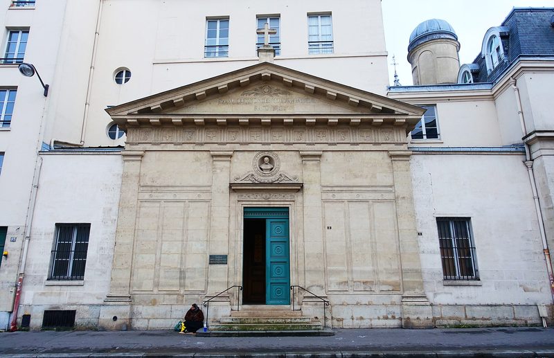 The Chapel of St Vincent de Paul in Paris: a pale neoclassical façade with columns and a pediment on a city street.