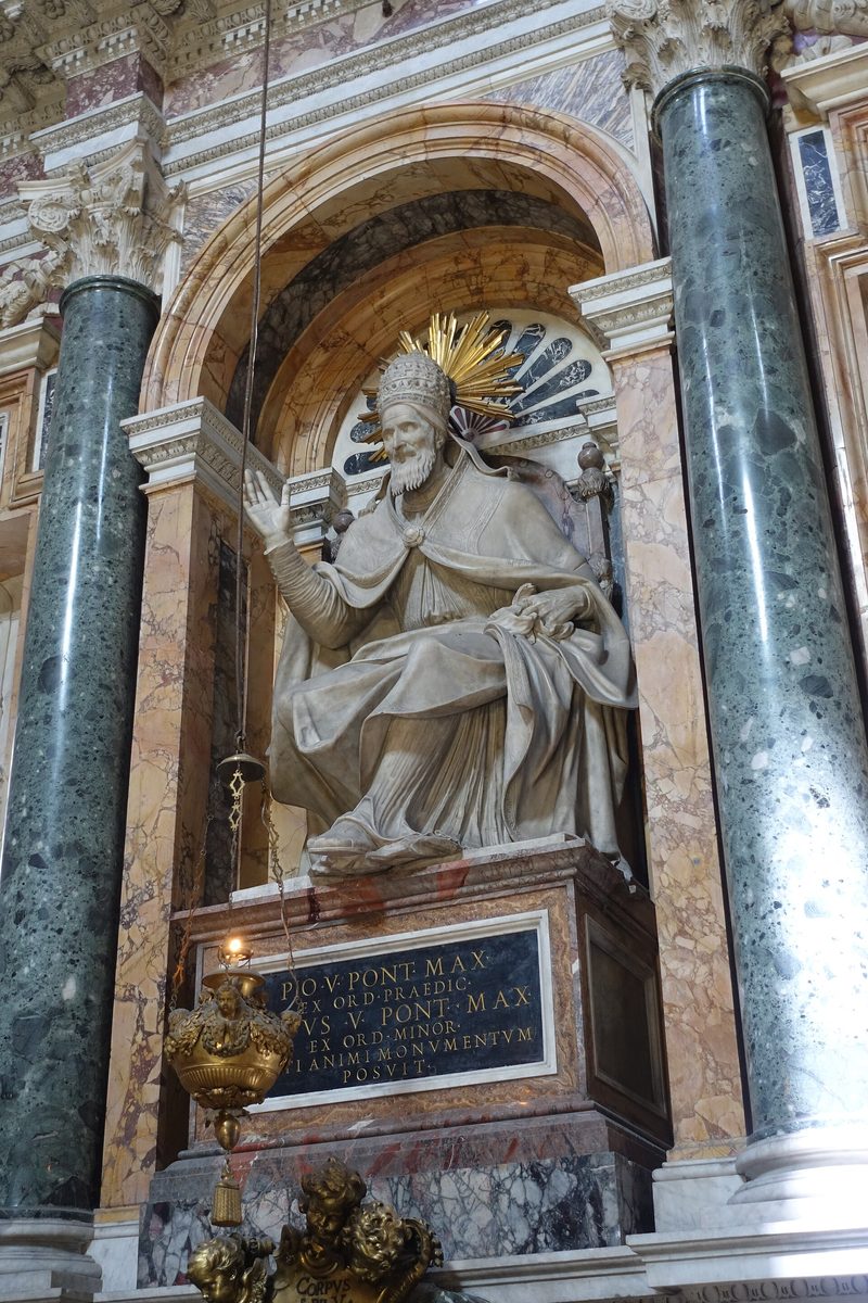 The marble monument of Pope St Pius V in the Sistine Chapel of Santa Maria Maggiore, Rome: a seated statue of the pope blessing.